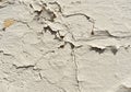 Texture of a concrete old wall with stains and cracks, white peeling paint background Royalty Free Stock Photo