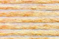 The texture of the concrete wall under the stylization of a wooden fence with horizontal logs Royalty Free Stock Photo