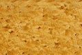 Texture of conglomerate or wooden aggregate panel in carpentry workshop