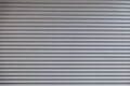 Texture of corrugated metal sheet, white or grey slide door Old roller shutter texture for background Royalty Free Stock Photo