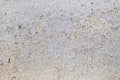 Texture of cracked gray paint on an old weathered wall. Dirty peeling paint on an outdoor surface. Grunge background Royalty Free Stock Photo