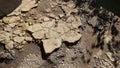 The texture of cracked old asphalt in need of repair. The road is full of holes and potholes Royalty Free Stock Photo