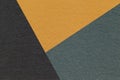 Texture of craft black, orange and green shade color paper background, macro. Vintage abstract cardboard Royalty Free Stock Photo