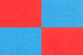 Texture of craft bright red and blue paper background with cells pattern. Structure of vintage kraft cerulean cardboard Royalty Free Stock Photo