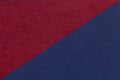 Texture of craft navy blue and dark red paper background, half two colors, macro. Structure of wine kraft cardboard