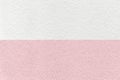 Texture of craft pastel white and pink paper background, half two colors, macro. Rose cardboard Royalty Free Stock Photo