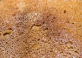 Texture of fried crust on a loaf of bread of home baking