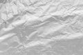 Texture of crumpled aluminum kitchen foil. Silver abstract blank for design