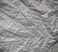 The texture of the crumpled gray paper. Abstract background. Selective focus