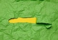 Texture of crumpled green paper with torn hole and yellow background, template for designer Royalty Free Stock Photo