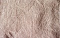 The texture of a crumpled natural linen beige grey color fabric texture background Royalty Free Stock Photo