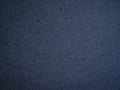 Texture of dark blue crumpled craft paper.