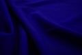 Texture of dark blue fabric closeup. Low key photo. Plexus threads. Clothing industry. Abstract background. Textile waves Royalty Free Stock Photo