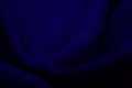 Texture of dark blue fabric closeup. Low key photo. Plexus threads. Clothing industry. Abstract background. Textile waves Royalty Free Stock Photo