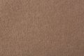 The texture of the dark brown felt. The background of dark brown cloth.