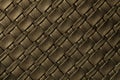 Texture of dark brown and bronze leather background with wicker pattern, macro Royalty Free Stock Photo