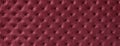 Texture of dark red leather background with capitone pattern, macro. Wine textile of retro Chesterfield style Royalty Free Stock Photo