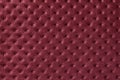 Texture of dark red leather background with capitone pattern, macro Royalty Free Stock Photo