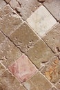 Texture of decorative brown ceramic tile with rhombus patterns, cracks and divorces