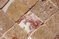 Texture of decorative brown ceramic tile with rhombus patterns, cracks and divorces