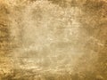 Texture decorative light beige plaster imitating old peeling wall with dark vignette. Obsolete golden stone background Royalty Free Stock Photo