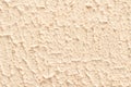 Texture of decorative rough pale pink putty.