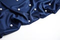 Texture of delicate dark blue silk with pearls on white background Royalty Free Stock Photo