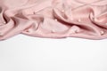 Texture of delicate pink silk with pearls on white background Royalty Free Stock Photo