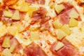 Texture of delicious fresh hawaiian pizza with sausage, pineapple and cheese Royalty Free Stock Photo