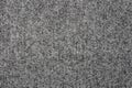 The texture of a dense gray carpet.