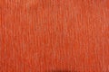 Texture of dense orange curtains. Fabric background with light lines and black stripes. Top view
