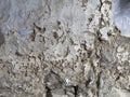 texture of a deteriorated old wall, with a partially repaired spalling, grunge cracked concrete wall Royalty Free Stock Photo