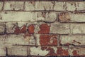 Texture of dilapidated brick wall close up. Dirty shabby brick wall in white peeling paint. White brick wall texture background. G Royalty Free Stock Photo