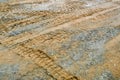 Texture of a dirty bad dirt road dirt road with puddles and clay drying mud with cracks and ruts. Off-road. The background Royalty Free Stock Photo