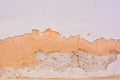 Texture of dirty destroyed concrete wall with exfoliated layer of white paint Royalty Free Stock Photo