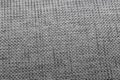 Texture by discoloured gray woven fabric, with lights. Royalty Free Stock Photo