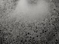 Texture of dishwashing detergent foam in the sink