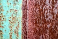 The texture is divided into half a rusty two-color red and green old shabby oxidized metal, iron with expanded white paint, pits a