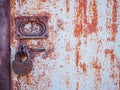 The texture of the door and the lock of the old rusty red metal Royalty Free Stock Photo