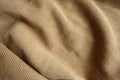 Texture of draped brown corduroy fabric