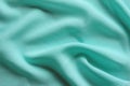 Draped mint-coloured chiffon fabric background