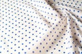 Texture. Drawing. Silk fabric. Polka blue on white background, I