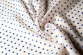 Texture. Drawing. Silk fabric. Polka blue on white background, I