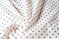 Texture. Drawing. Silk fabric. Polka blue on white background, I