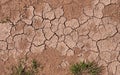 Texture of red dried cracked clay. Macro background image of dried clay Royalty Free Stock Photo