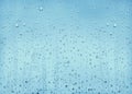 Texture drops of water on a transparent glass blue Royalty Free Stock Photo