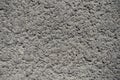 Texture of dusty grey grainy concrete wall