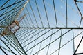 Texture of an electric pylon and the blue sky Royalty Free Stock Photo