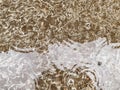 Texture, epoxy mixed in layers. white and gold resin paint, abstract background. liquid material creates a wave effect. Royalty Free Stock Photo