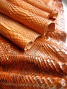 Texture of exotic skin. The skin of a python, a snake is red, orange. Royalty Free Stock Photo